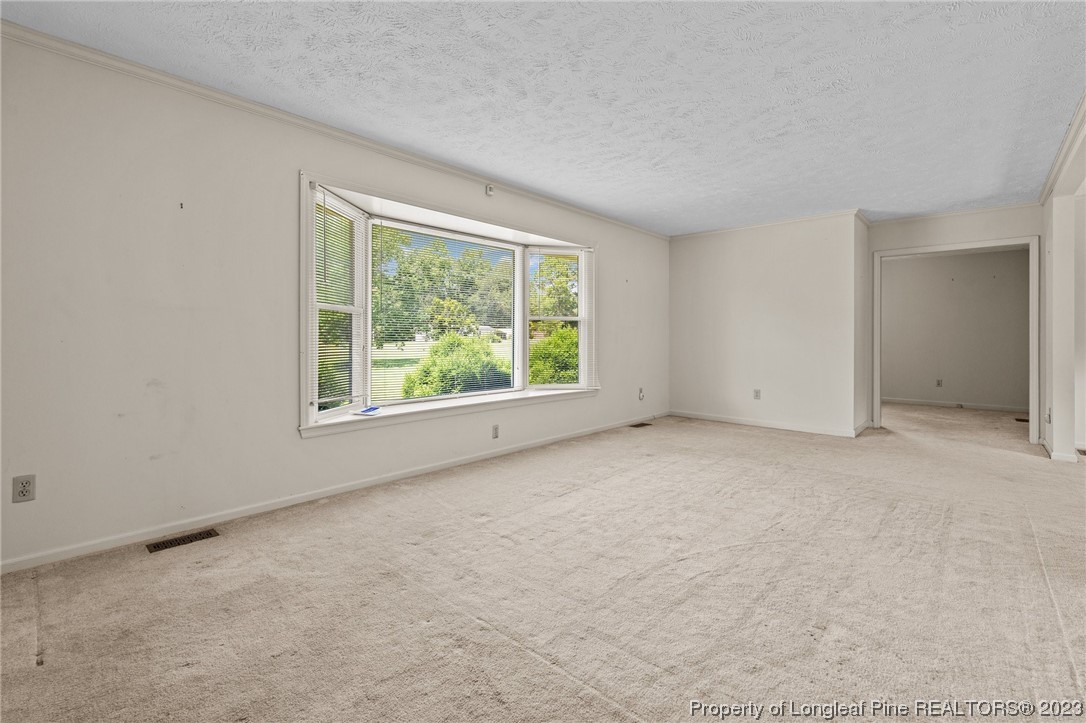 1812 Bainbridge Road Stedman, NC 28391 - Photo 10 of 30 an empty room with windows