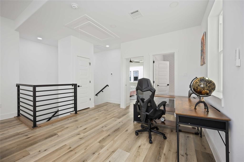 1805 Emir Street, Unit L Houston, TX 77009 - Photo 24 of 35 The stairs from the second floor lead to this gorgeous open and large flex space that could be a second family room, home gym, home office, or gameroom.