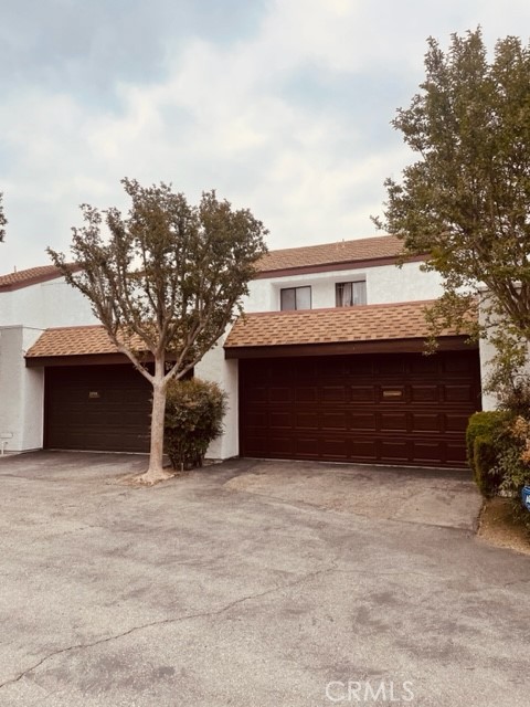 11918 Heritage Circle Downey, CA 90241 - Photo 2 of 21 a front view of house with yard
