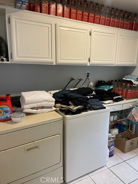 11918 Heritage Circle Downey, CA 90241 - Photo 4 of 21 a kitchen with a stove and cabinets