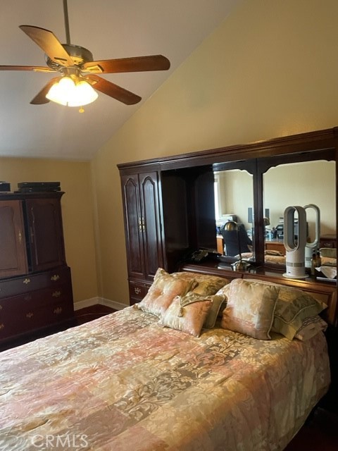 11918 Heritage Circle Downey, CA 90241 - Photo 8 of 21 a bedroom with a bed a dresser and chandelier