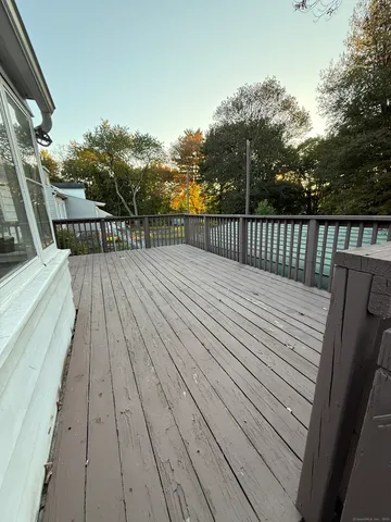 a balcony with wooden floor