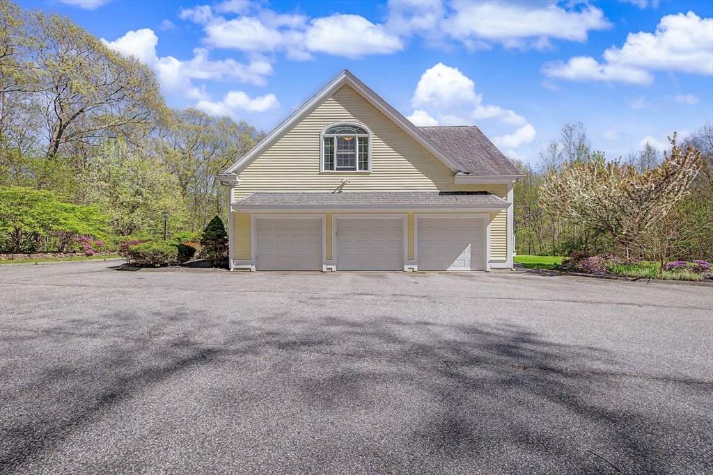 270 Mendon Road Sutton, MA 01590 - Photo 3 of 42 a view of a house with a yard and garage