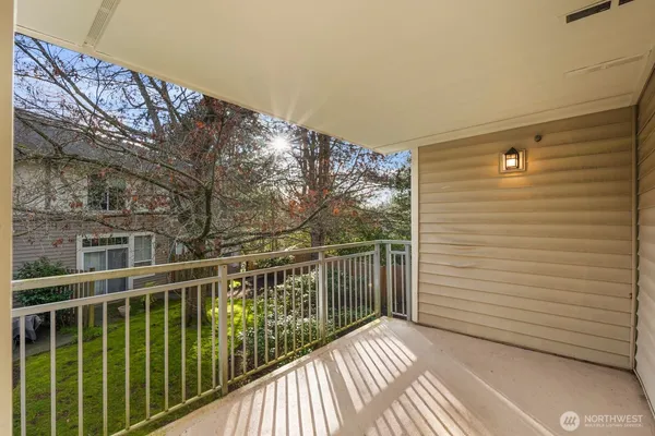 a view of a balcony with wooden floor