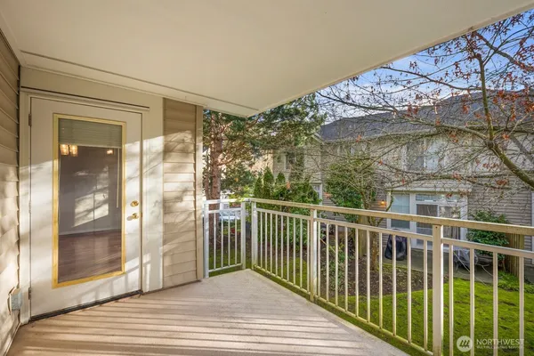 a view of a balcony with wooden floor