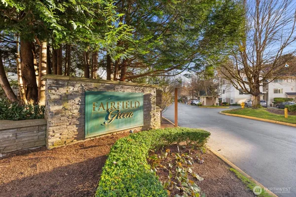 a sign board with parking space