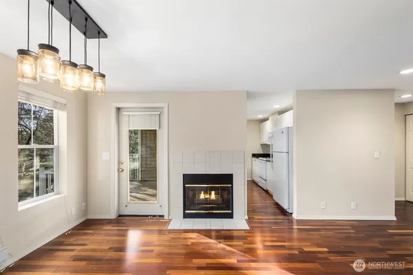 a view of a livingroom with a fireplace and window