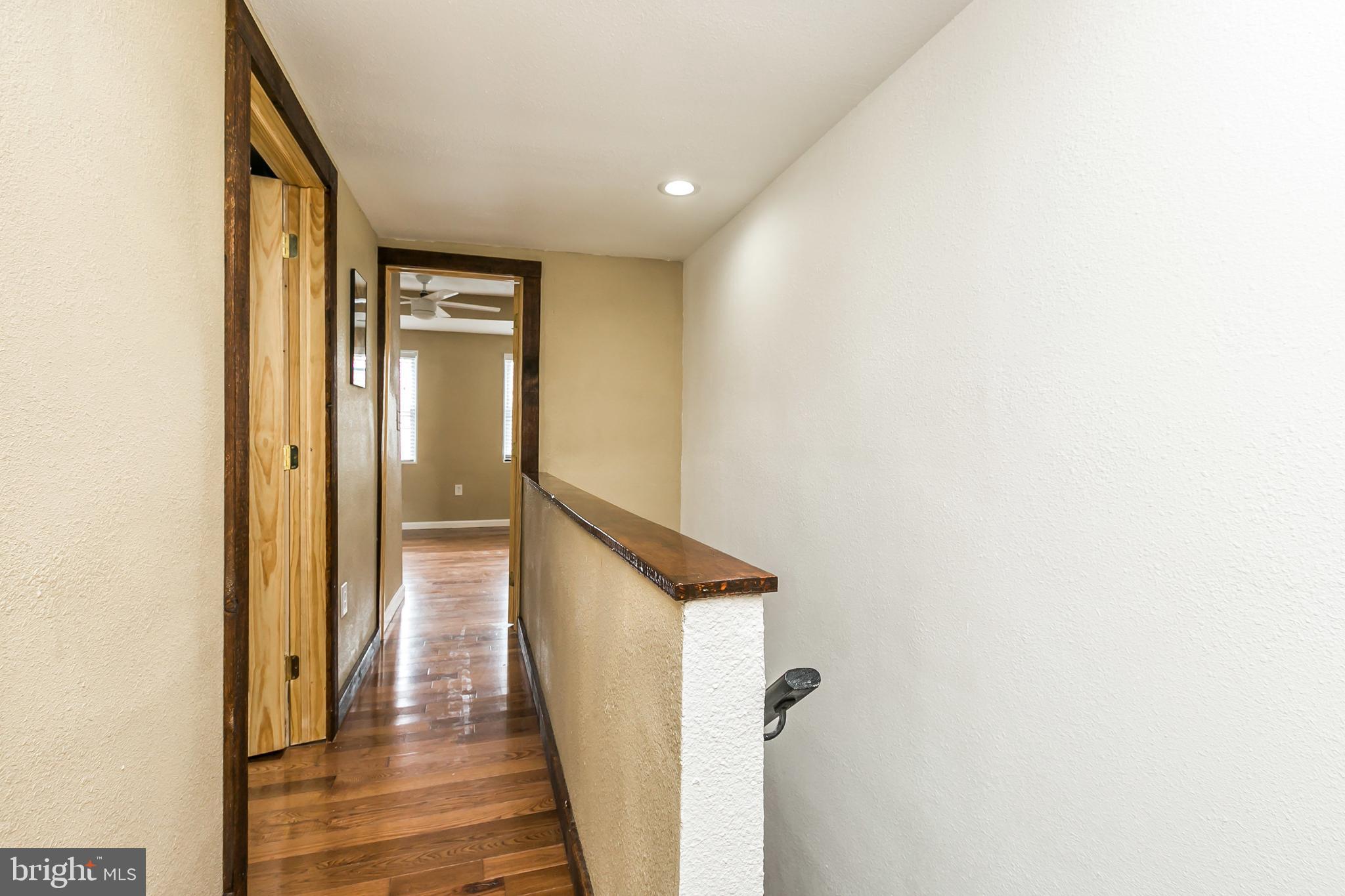 609 Wyeth Street Baltimore, MD 21230 - Photo 17 of 32 a view of a hallway with wooden floor