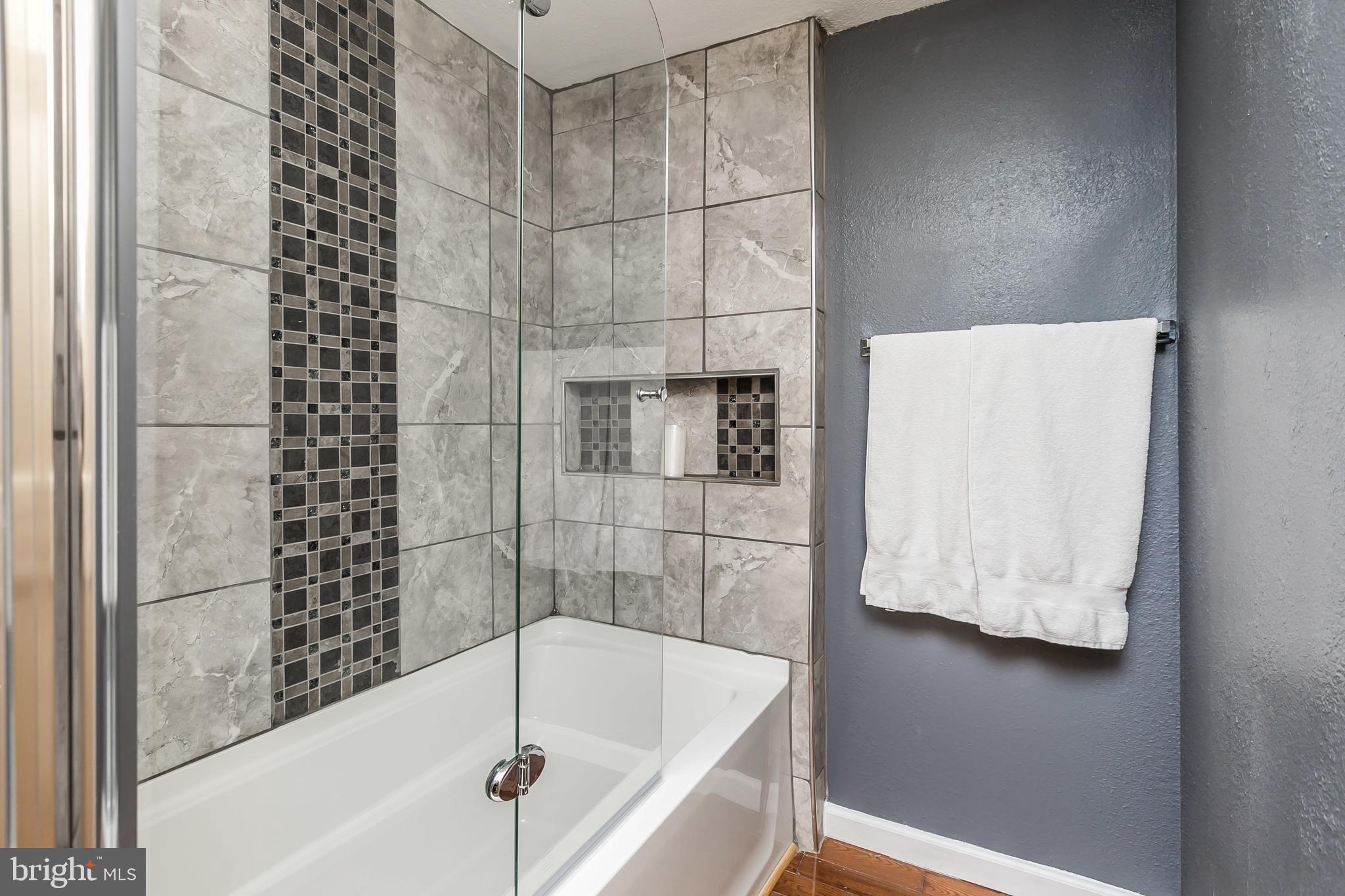 609 Wyeth Street Baltimore, MD 21230 - Photo 20 of 32 a bathroom with a bathtub and shower