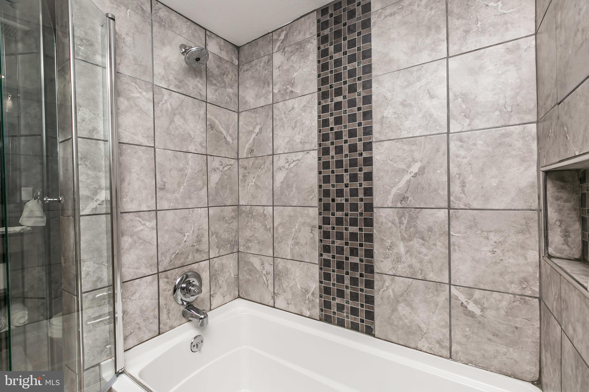 609 Wyeth Street Baltimore, MD 21230 - Photo 21 of 32 a bathroom with a bathtub and shower