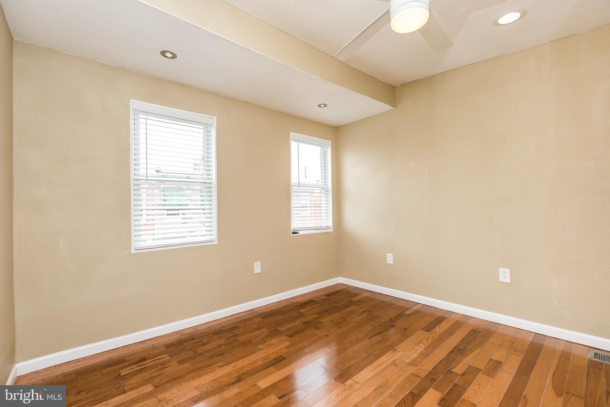 609 Wyeth Street Baltimore, MD 21230 - Photo 24 of 32 a view of empty room with wooden floor