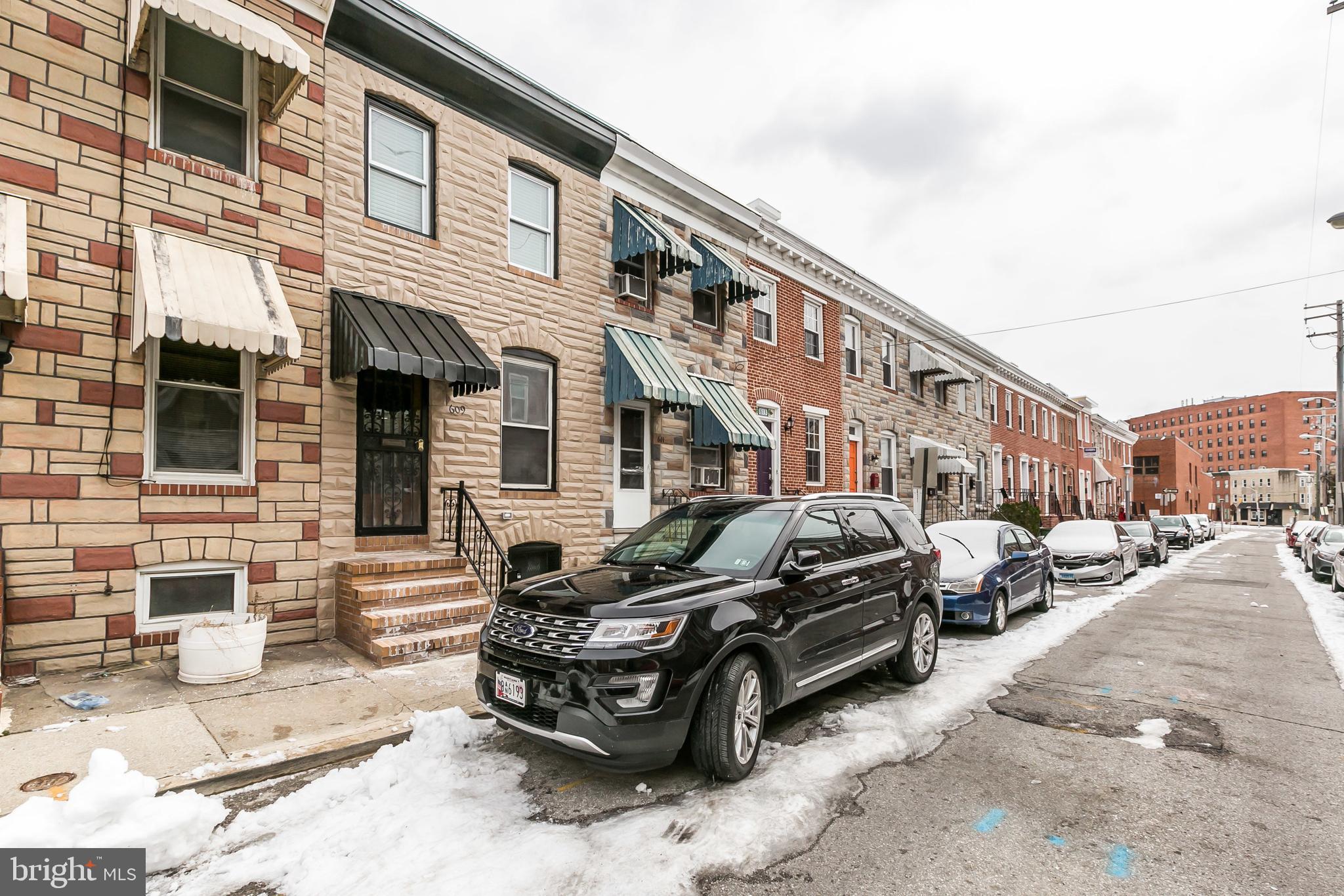 609 Wyeth Street Baltimore, MD 21230 - Photo 29 of 32 a car parked in front of a building