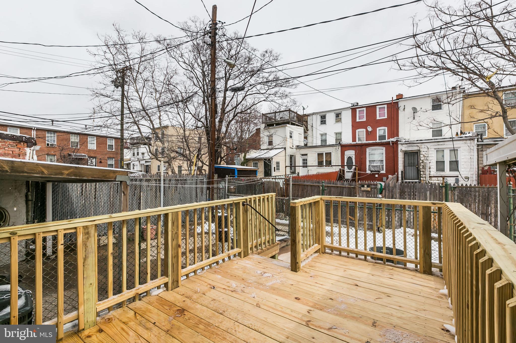 609 Wyeth Street Baltimore, MD 21230 - Photo 32 of 32 a view of a balcony with wooden floor and fence