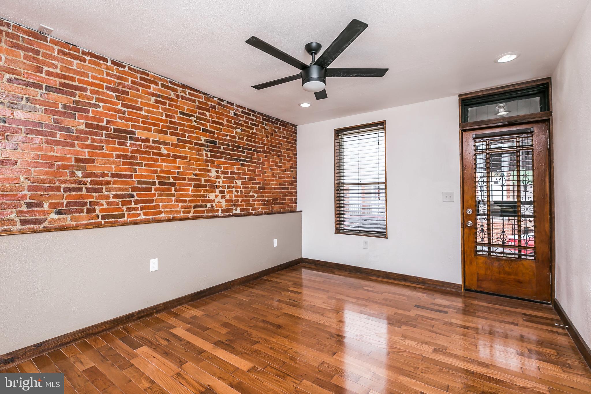 609 Wyeth Street Baltimore, MD 21230 - Photo 5 of 32 a view of an empty room with a window