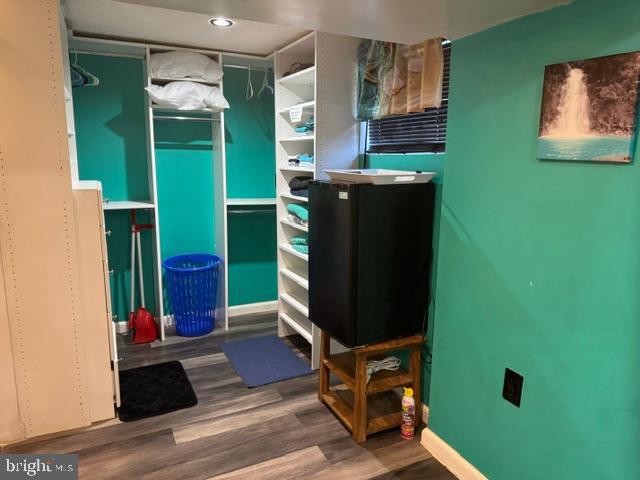 4603 Raleigh Road Temple Hills, MD 20748 - Photo 17 of 40 a room with cabinets and a wooden floor