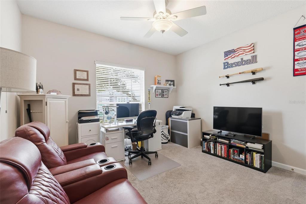 207 Coleton Lane DeLand, FL 32724 - Photo 15 of 65 a livingroom with workspace and a couch