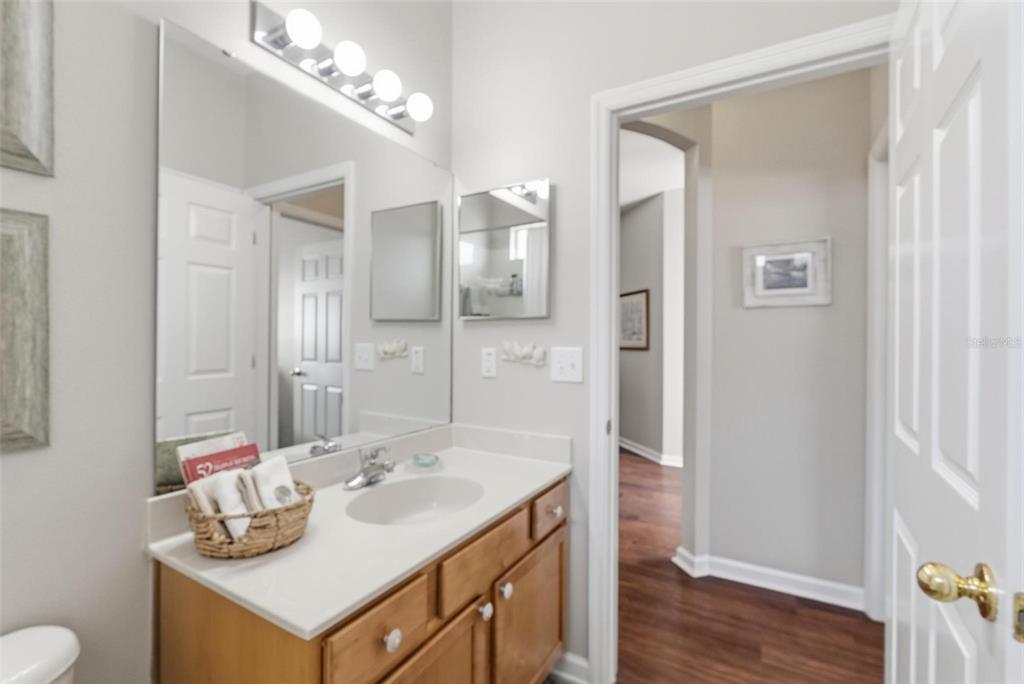 207 Coleton Lane DeLand, FL 32724 - Photo 17 of 65 a bathroom with a sink vanity granite and a mirror