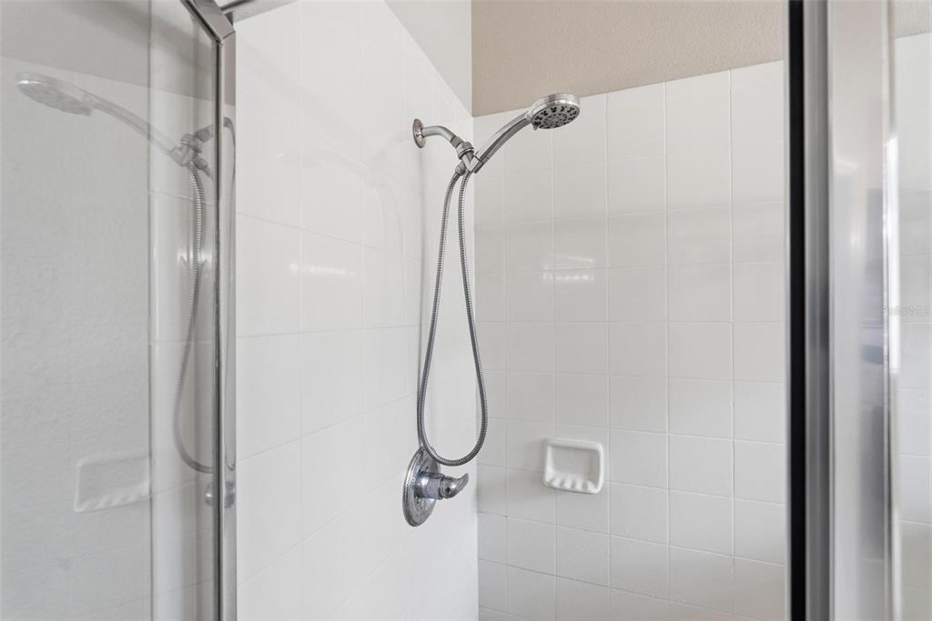 207 Coleton Lane DeLand, FL 32724 - Photo 30 of 65 a bathroom with a glass shower door