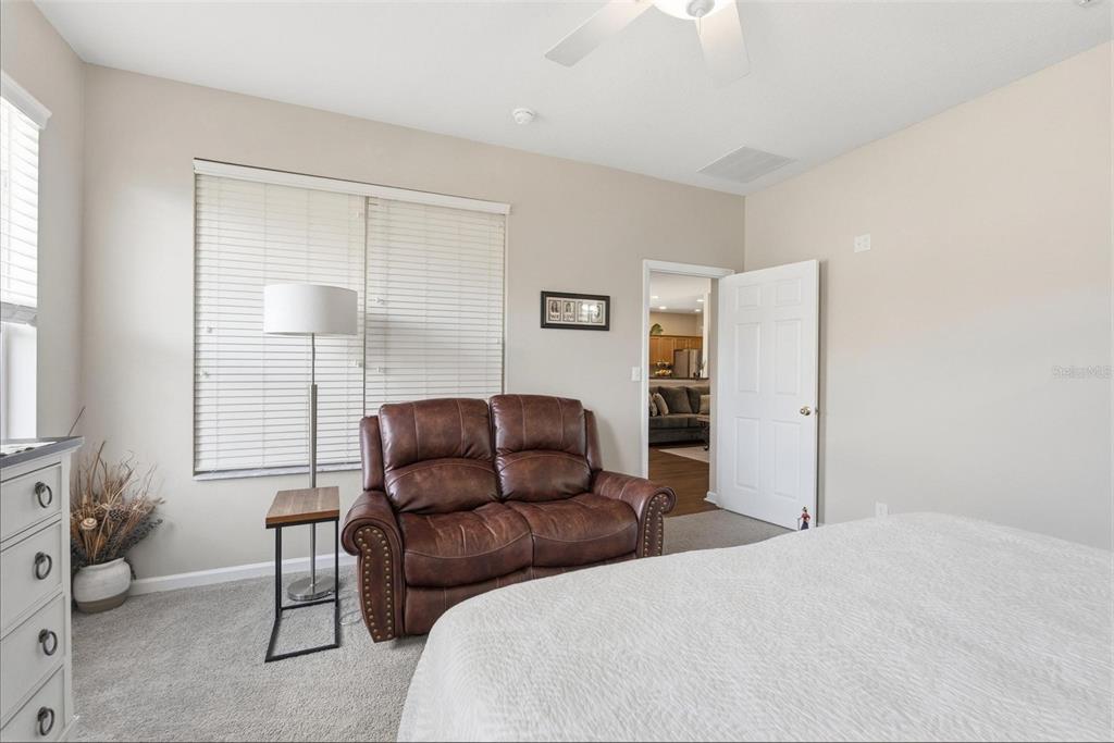 207 Coleton Lane DeLand, FL 32724 - Photo 37 of 65 a bedroom with a bed and wooden floor