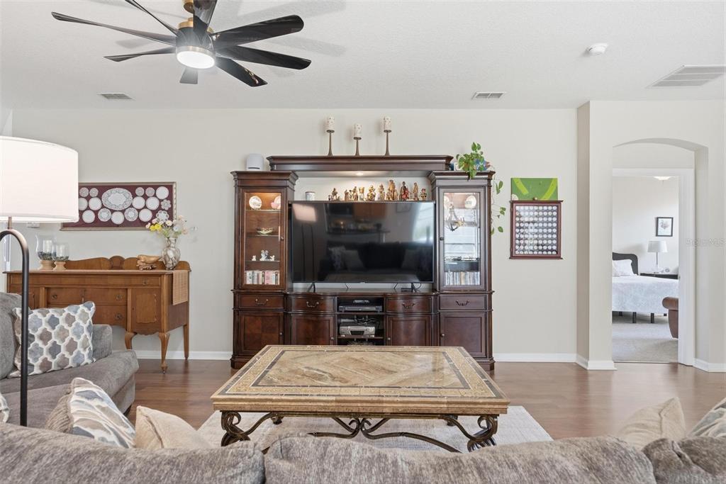 207 Coleton Lane DeLand, FL 32724 - Photo 4 of 65 a living room with furniture and a flat screen tv