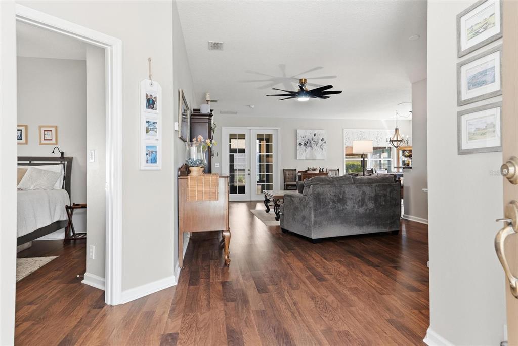 207 Coleton Lane DeLand, FL 32724 - Photo 42 of 65 a living room with furniture and a wooden floor