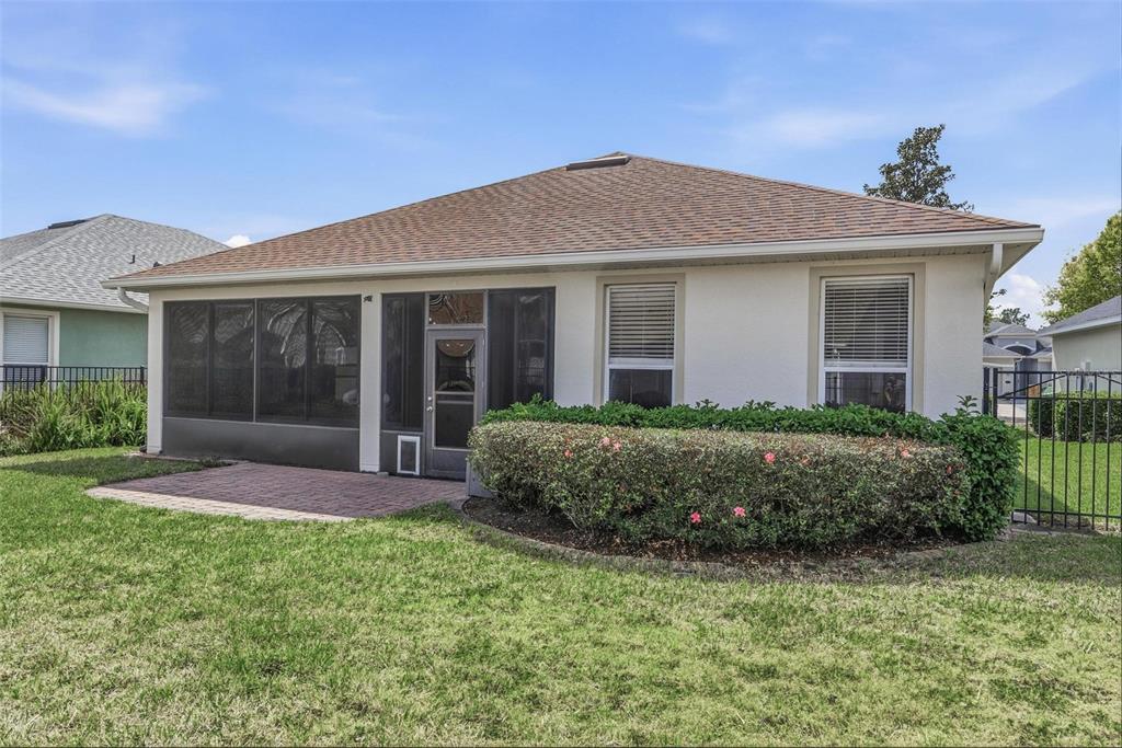 207 Coleton Lane DeLand, FL 32724 - Photo 56 of 65 a front view of a house with a garden