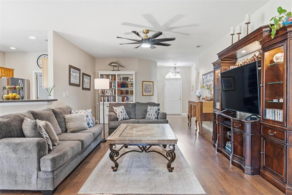 207 Coleton Lane DeLand, FL 32724 - Photo 6 of 65 a living room with furniture and a flat screen tv