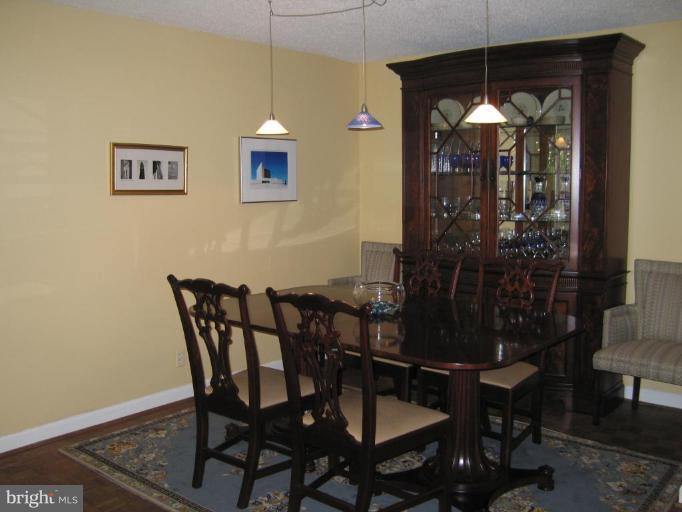 1077 30th Street Northwest, Unit 304 Washington, DC 20007 - Photo 3 of 27 a view of a dining room with furniture