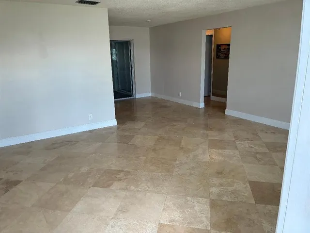 an empty room with an entryway door