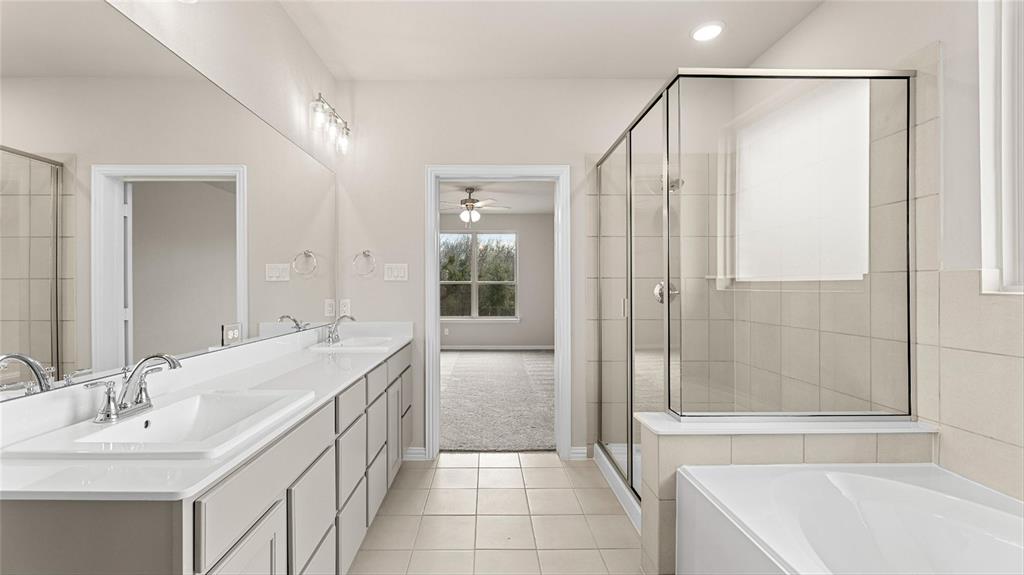 348 Deer Rdg Drive Aledo, TX 76008 - Photo 7 of 15 a bathroom with a tub sink and mirror