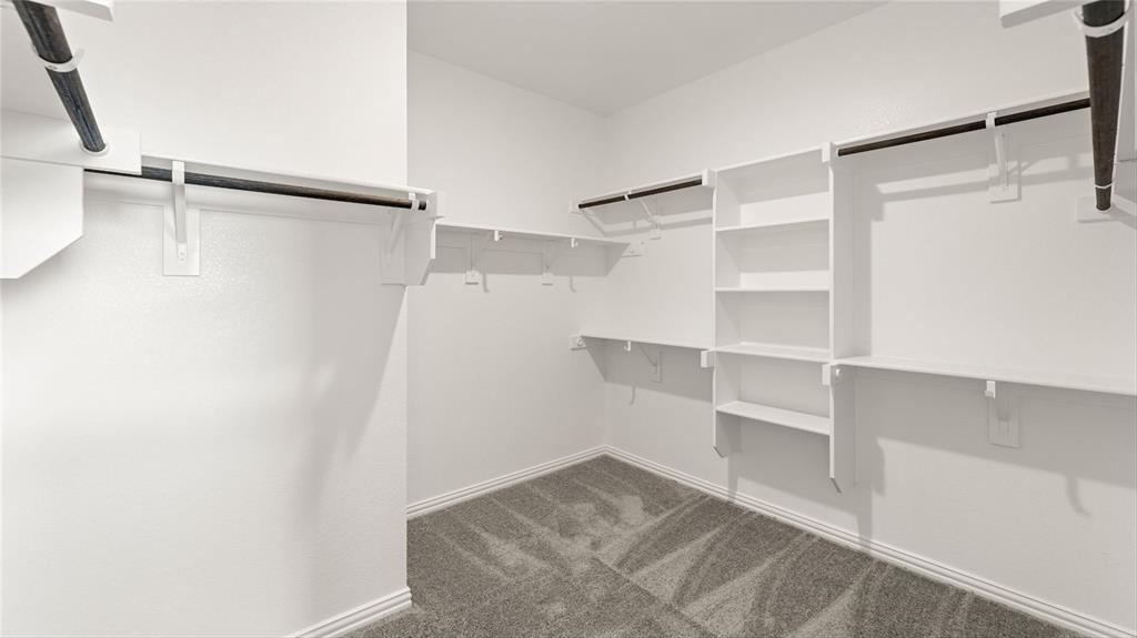348 Deer Rdg Drive Aledo, TX 76008 - Photo 8 of 15 a view of walk in closet with empty racks