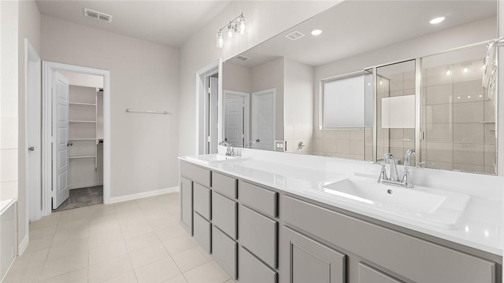 348 Deer Rdg Drive Aledo, TX 76008 - Photo 6 of 15 a bathroom with a double vanity sink mirror and shower