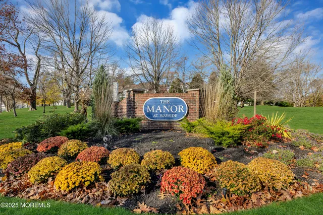 a view of a sign board with yard