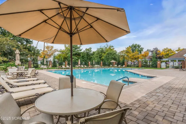 a view of a swimming pool with a patio
