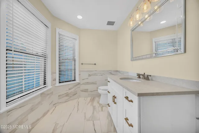 a bathroom with a sink double vanity and shower