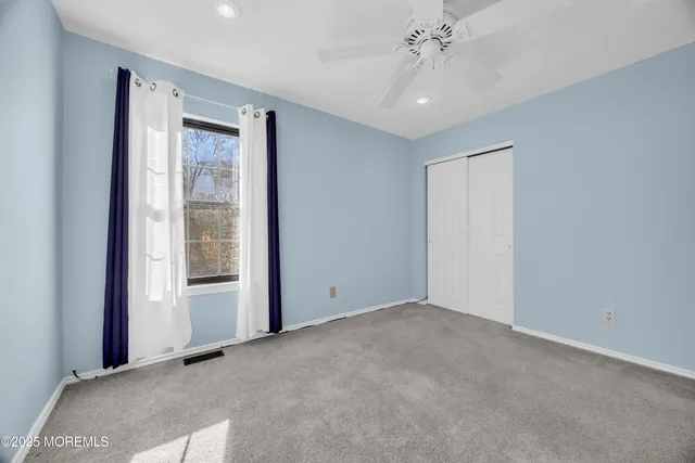 a bathroom with a granite countertop sink mirror and bathtub