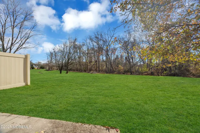 a view of a building with a yard