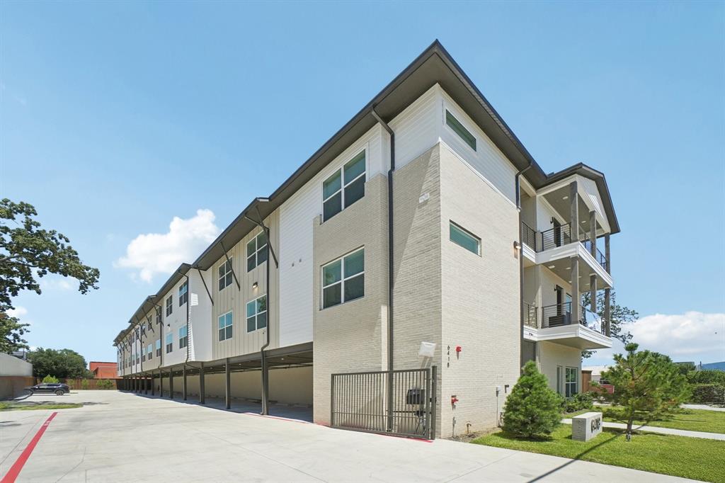 6418 Maple Avenue, Unit 307 Dallas, TX 75235 - Photo 1 of 16 a front view of a house with large windows