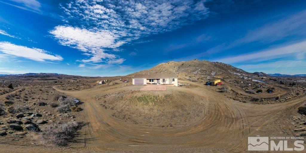 1230 Bullion Hill Road Reno, NV 89508 - Photo 23 of 26 a view of a fireplace in a field