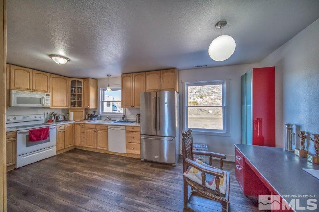 1230 Bullion Hill Road Reno, NV 89508 - Photo 3 of 26 a kitchen with stainless steel appliances granite countertop a refrigerator sink and stove