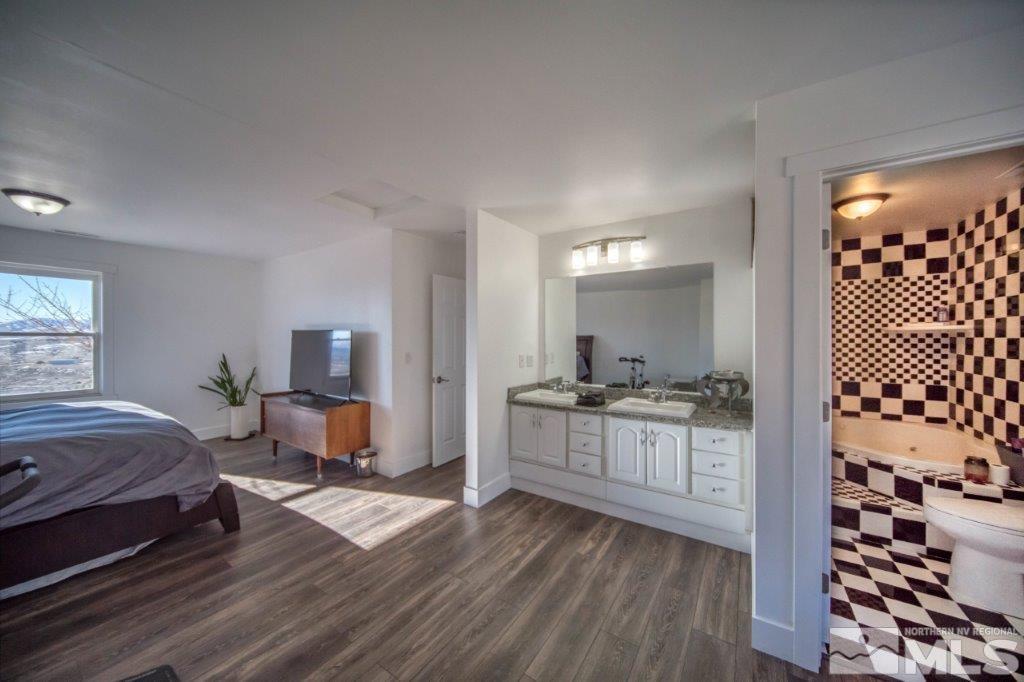 1230 Bullion Hill Road Reno, NV 89508 - Photo 7 of 26 a kitchen with sink cabinets and dining area view