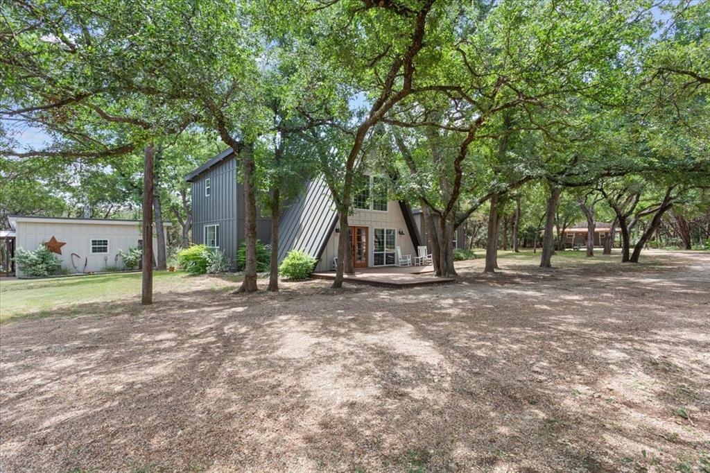 15988 Wortham Bend Road China Spring, TX 76633 - Photo 3 of 40 Beautiful view of home nestled in the oak trees