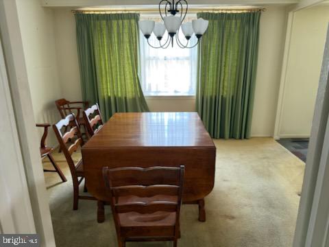 12206 Maycheck Lane Bowie, MD 20715 - Photo 13 of 19 a view of a room with a table and chairs