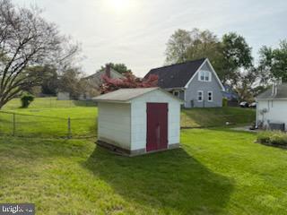 12206 Maycheck Lane Bowie, MD 20715 - Photo 16 of 19 a view of a house with a yard