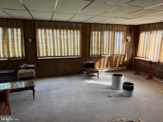 12206 Maycheck Lane Bowie, MD 20715 - Photo 5 of 19 a living room with furniture and large windows