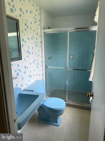 12206 Maycheck Lane Bowie, MD 20715 - Photo 7 of 19 a bathroom with a shower and a toilet