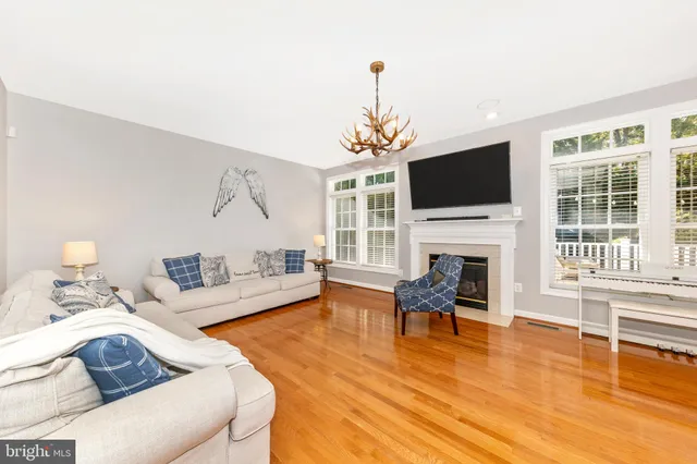 a living room with furniture fireplace and a flat screen tv