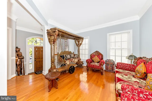 a living room with furniture gym equipment and a large window