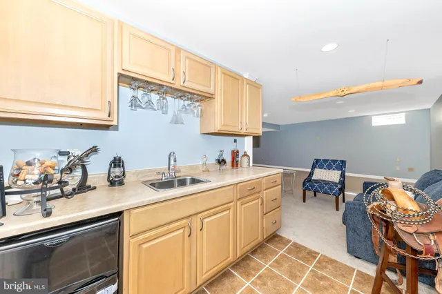 a kitchen with a sink and cabinets