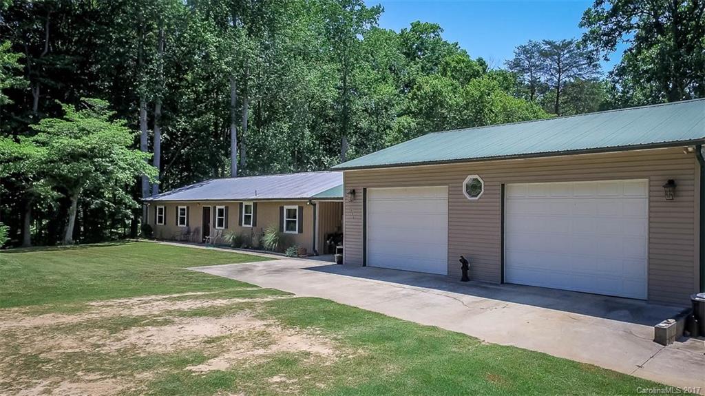1606 Windsong Forest Road Clover, SC 29710 - Photo 2 of 15 a front view of a house with a yard and trees